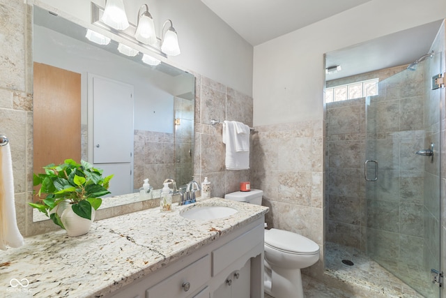 3388 S Leonard Rd, New Palestine, IN 46163 - bathroom featuring tile walls, vanity, and a shower stall