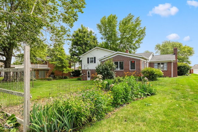 3388 S Leonard Rd, New Palestine, IN 46163 - view of front of home with brick siding, a chimney, and a front lawn