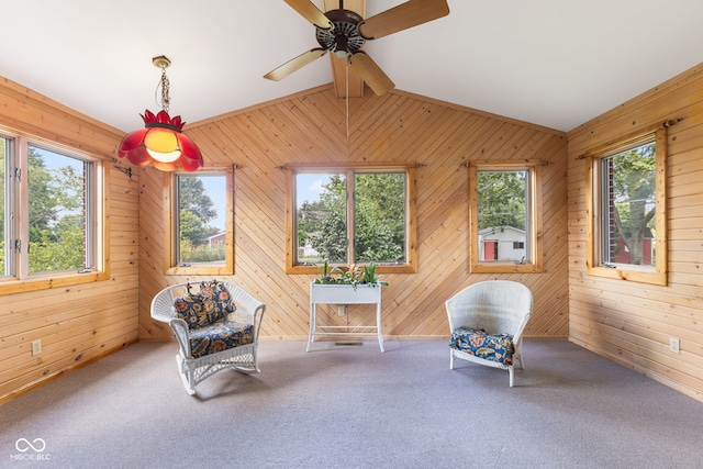 3388 S Leonard Rd, New Palestine, IN 46163 - living area featuring ceiling fan, carpet, wood walls, and lofted ceiling