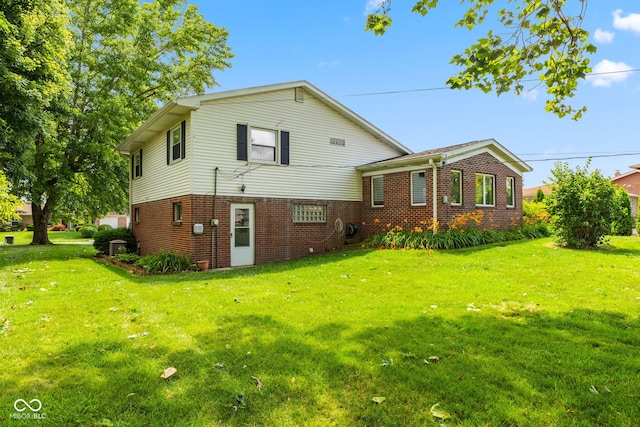 3388 S Leonard Rd, New Palestine, IN 46163 - back of house featuring brick siding and a lawn