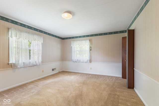 3388 S Leonard Rd, New Palestine, IN 46163 - carpeted empty room featuring wallpapered walls and baseboards