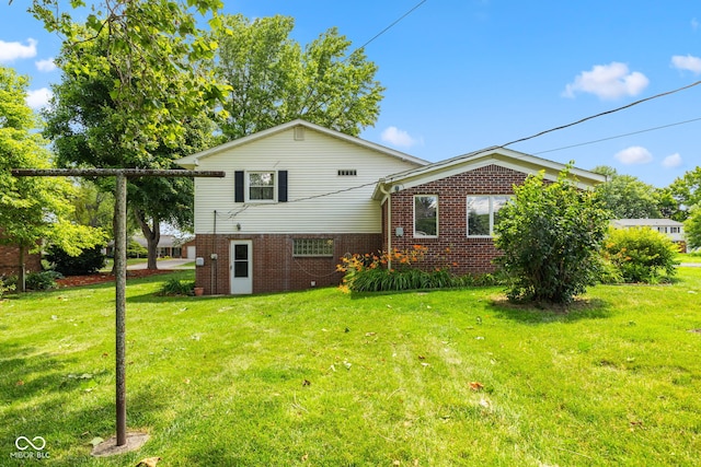 3388 S Leonard Rd, New Palestine, IN 46163 - back of house featuring a yard and brick siding