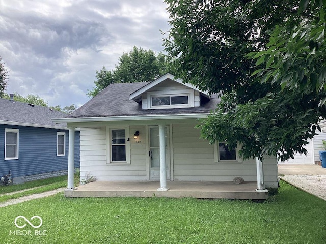 360 Laclede St, Indianapolis, IN 46241 - bungalow-style home featuring a porch, a front yard, and roof with shingles