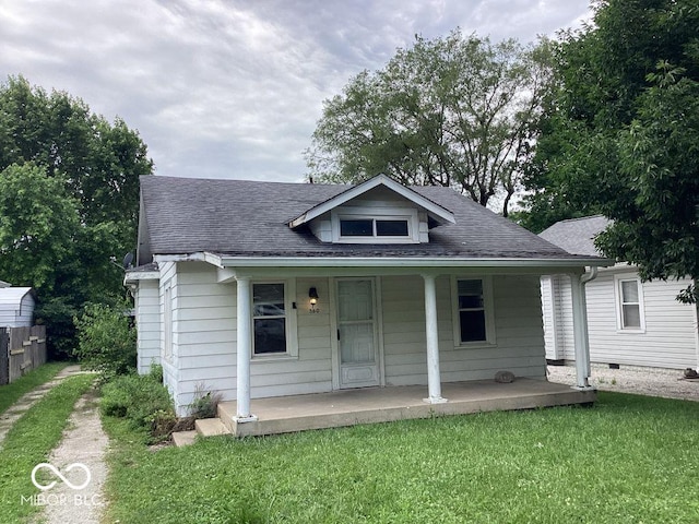 360 Laclede St, Indianapolis, IN 46241 - bungalow-style house featuring a porch, a front lawn, and a shingled roof
