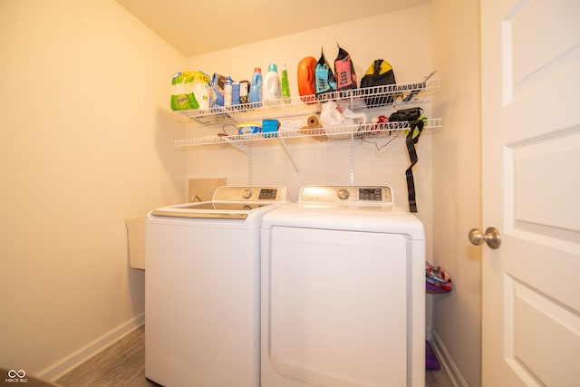610 Sawtooth St, Westfield, IN 46074 - laundry room featuring washer and clothes dryer and wood finished floors