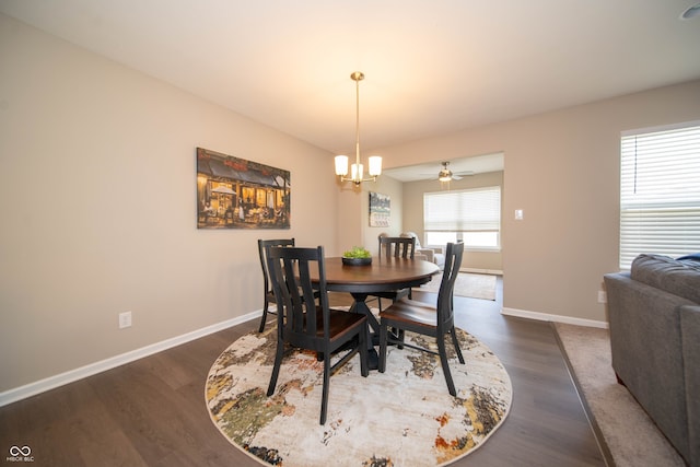 610 Sawtooth St, Westfield, IN 46074 - dining room with dark wood-type flooring, a chandelier, and a ceiling fan
