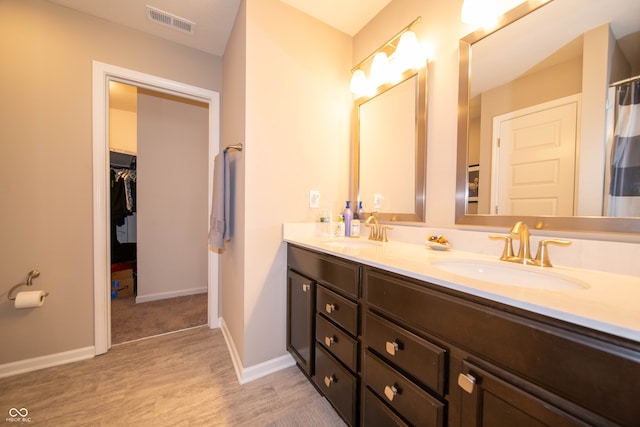 610 Sawtooth St, Westfield, IN 46074 - full bath featuring double vanity, wood finished floors, and a walk in closet