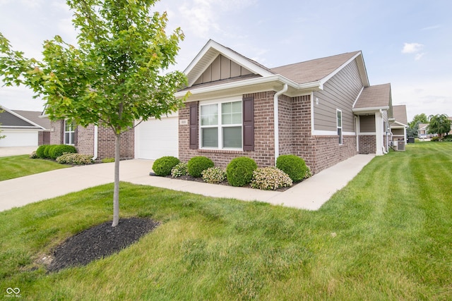 610 Sawtooth St, Westfield, IN 46074 - view of front of property featuring brick siding, a front yard, driveway, and an attached garage