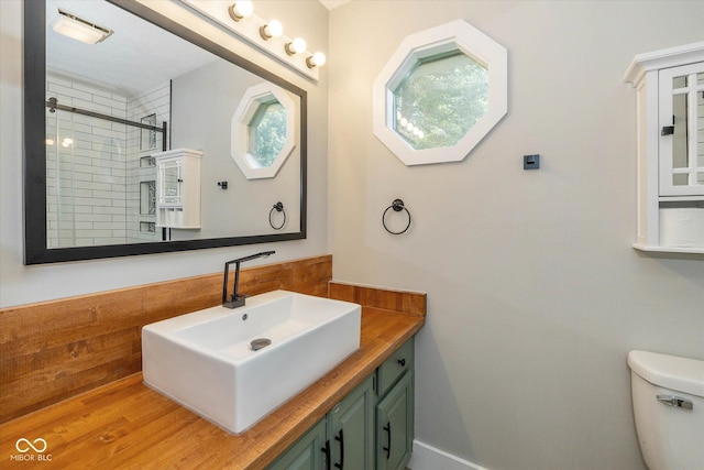 12661 Doe Ln, Indianapolis, IN 46236 - full bathroom featuring vanity, a tile shower, and wood finished floors