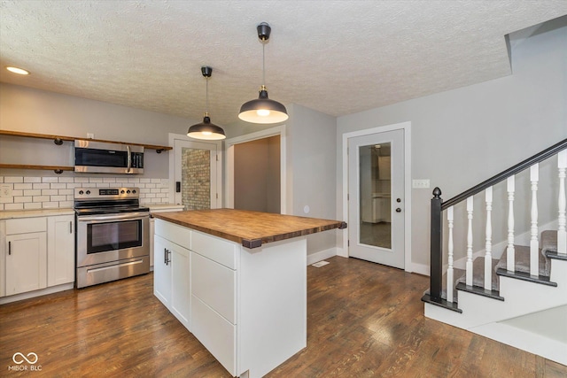 12661 Doe Ln, Indianapolis, IN 46236 - kitchen featuring stainless steel appliances, butcher block countertops, dark wood-style flooring, backsplash, and white cabinetry