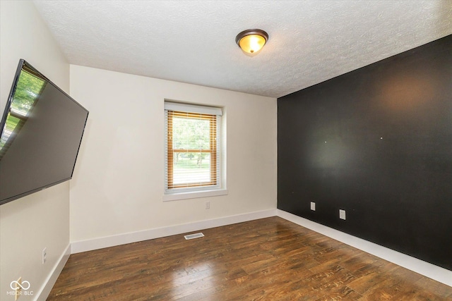 12661 Doe Ln, Indianapolis, IN 46236 - unfurnished room with wood finished floors and a textured ceiling