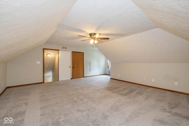 12661 Doe Ln, Indianapolis, IN 46236 - additional living space with a textured ceiling, vaulted ceiling, carpet, and ceiling fan