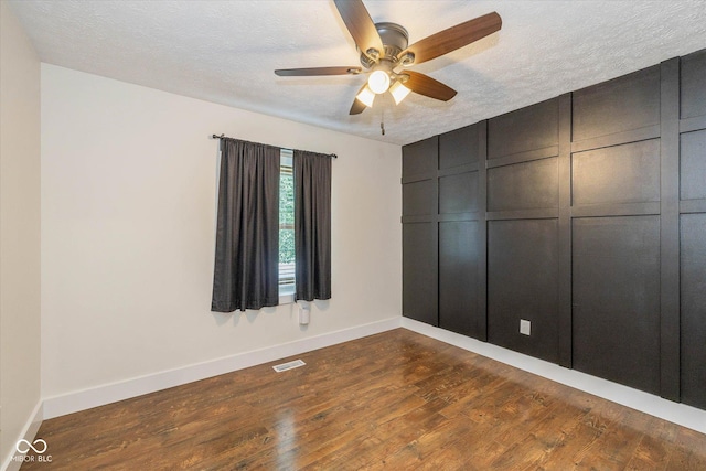 12661 Doe Ln, Indianapolis, IN 46236 - unfurnished bedroom with dark wood-type flooring, a textured ceiling, and ceiling fan