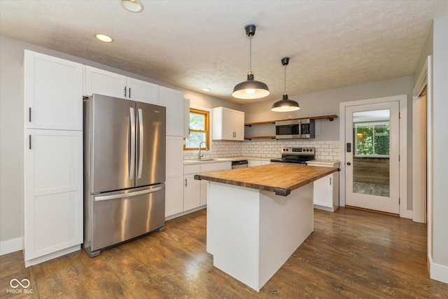 12661 Doe Ln, Indianapolis, IN 46236 - kitchen featuring stainless steel appliances, butcher block countertops, open shelves, white cabinetry, and tasteful backsplash