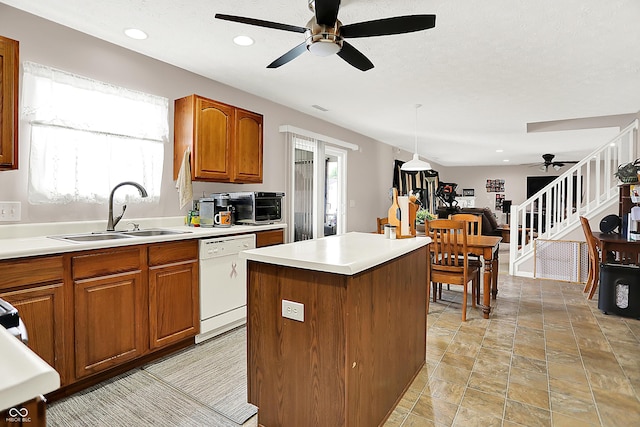 5063 Haywood Ln, Plainfield, IN 46168 - kitchen featuring dishwasher, a ceiling fan, brown cabinetry, light countertops, and recessed lighting