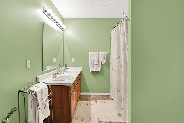 5063 Haywood Ln, Plainfield, IN 46168 - full bathroom featuring double vanity, tile patterned flooring, a textured ceiling, and curtained shower
