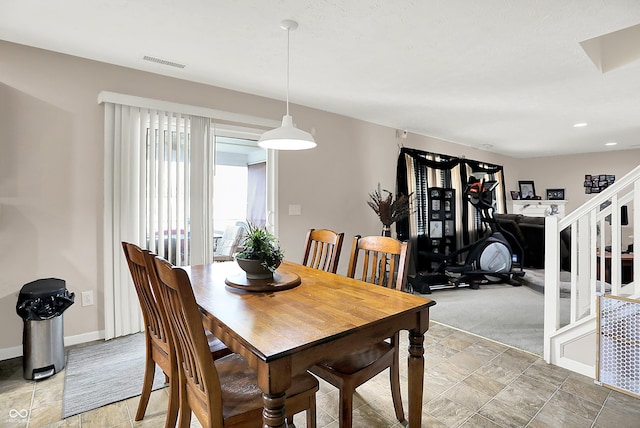5063 Haywood Ln, Plainfield, IN 46168 - dining space featuring light stone finish floors and stairway