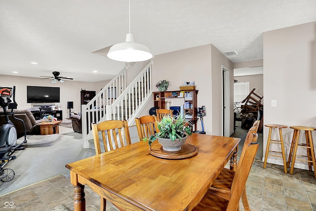 5063 Haywood Ln, Plainfield, IN 46168 - dining space with stairs, stone finish floors, a ceiling fan, and recessed lighting