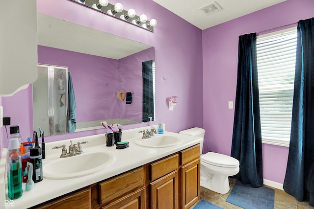 5063 Haywood Ln, Plainfield, IN 46168 - full bathroom featuring healthy amount of natural light, tile patterned floors, double vanity, and a shower