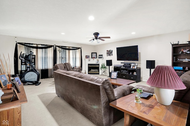 5063 Haywood Ln, Plainfield, IN 46168 - living area featuring a ceiling fan, light carpet, recessed lighting, and a glass covered fireplace