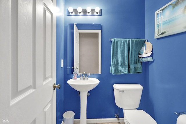 5063 Haywood Ln, Plainfield, IN 46168 - half bathroom featuring toilet and baseboards