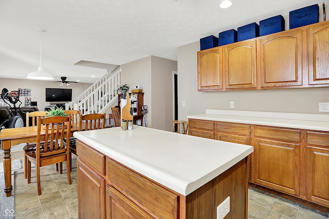 5063 Haywood Ln, Plainfield, IN 46168 - kitchen featuring ceiling fan, a kitchen island, light countertops, recessed lighting, and decorative light fixtures