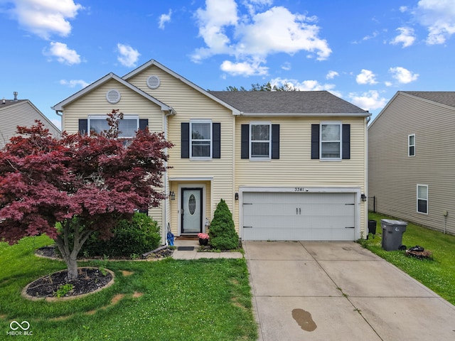 3341 Carica Dr, Indianapolis, IN 46203 - traditional home featuring an attached garage, concrete driveway, and a front lawn