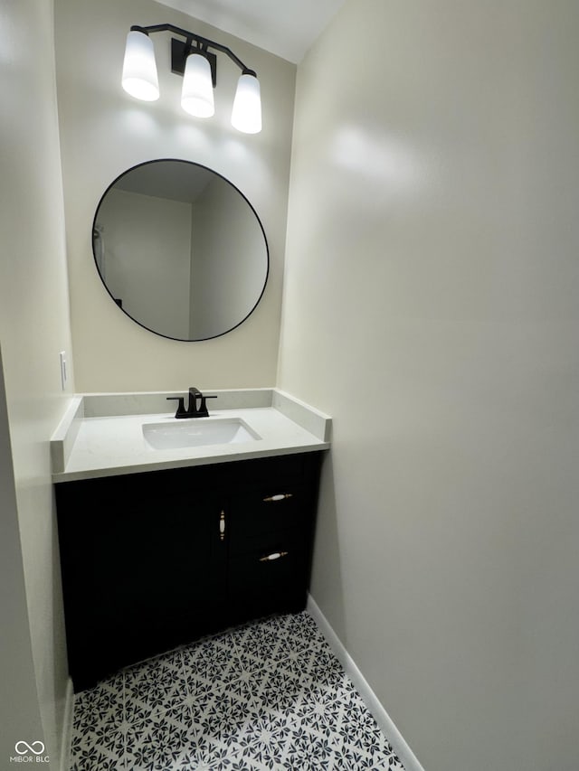 1400 Evelyn Ln, Anderson, IN 46017 - bathroom featuring baseboards and vanity