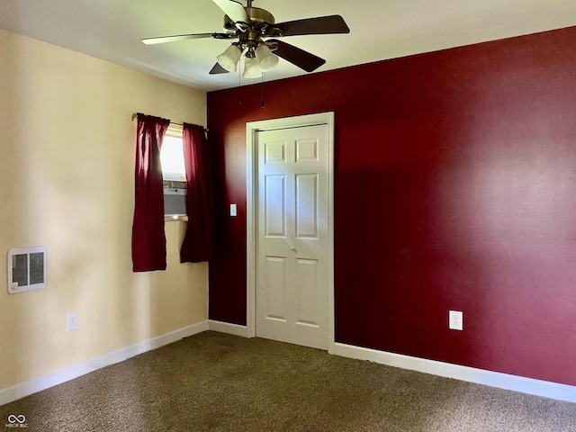 1400 Evelyn Ln, Anderson, IN 46017 - empty room featuring ceiling fan and dark carpet
