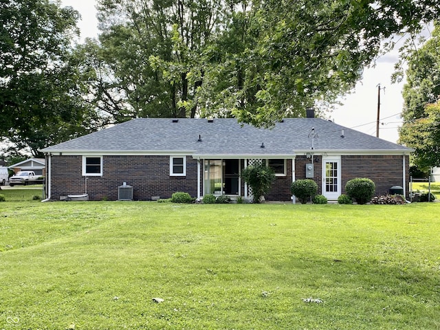 1400 Evelyn Ln, Anderson, IN 46017 - view of front of house featuring brick siding, a front yard, and roof with shingles
