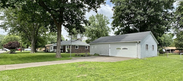 1400 Evelyn Ln, Anderson, IN 46017 - view of front of home with an outbuilding, a garage, and concrete driveway