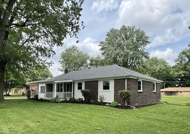 1400 Evelyn Ln, Anderson, IN 46017 - ranch-style home with brick siding, a shingled roof, and a chimney