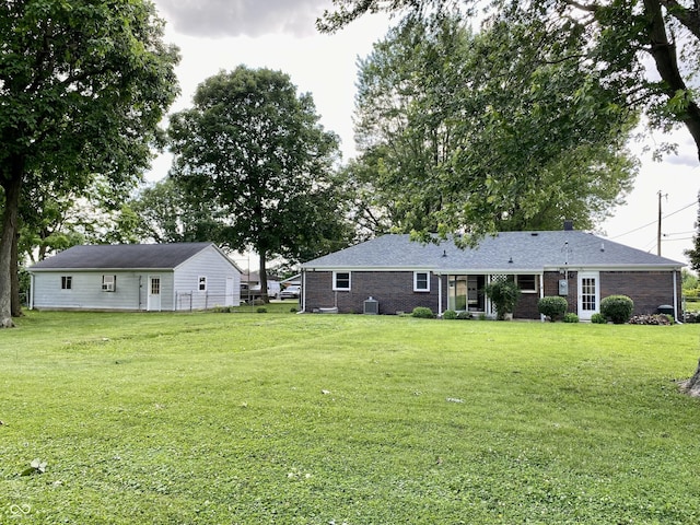 1400 Evelyn Ln, Anderson, IN 46017 - rear view of property with a yard and brick siding