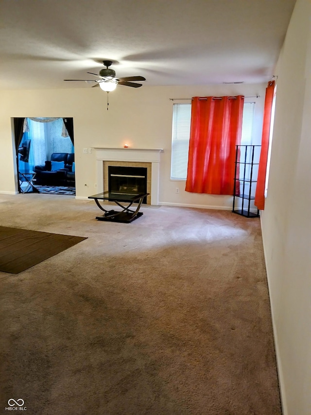 8333 Pine Branch Ln, Indianapolis, IN 46234 - carpeted living area with a fireplace and ceiling fan