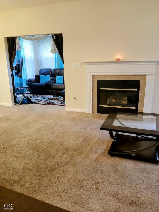 8333 Pine Branch Ln, Indianapolis, IN 46234 - carpeted living room featuring a tile fireplace and baseboards