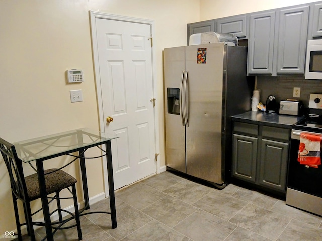 8333 Pine Branch Ln, Indianapolis, IN 46234 - kitchen with stainless steel appliances, dark countertops, and tasteful backsplash