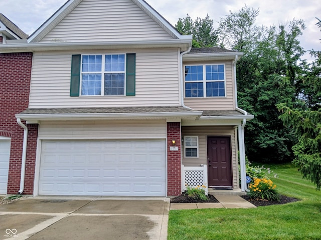 8333 Pine Branch Ln, Indianapolis, IN 46234 - multi unit property featuring an attached garage, driveway, and brick siding