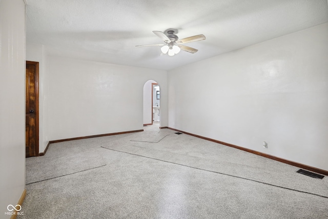 11710 W State Road 32, Yorktown, IN 47396 - spare room featuring arched walkways, a ceiling fan, and carpet floors