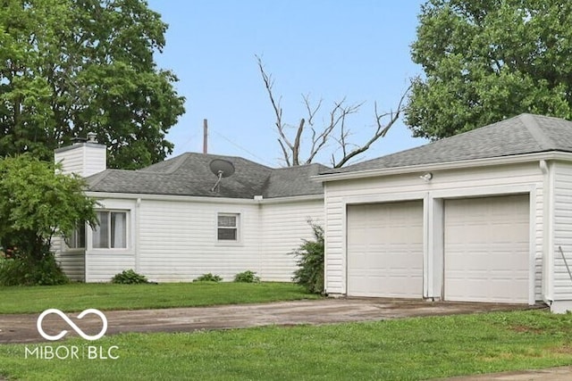 11710 W State Road 32, Yorktown, IN 47396 - view of front facade with a garage, driveway, a chimney, and a front lawn