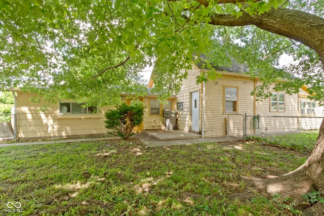 29 E Caven St, Indianapolis, IN 46225 - rear view of house featuring a patio