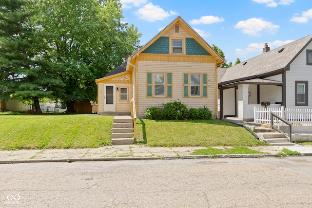 29 E Caven St, Indianapolis, IN 46225 - victorian home with a front lawn and a porch