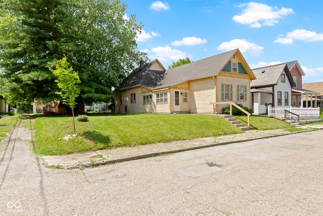 29 E Caven St, Indianapolis, IN 46225 - view of front of house with a front yard and roof with shingles