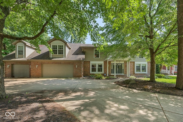 3710 Canada Ct, West Lafayette, IN 47906 - traditional-style house with brick siding, driveway, and a garage