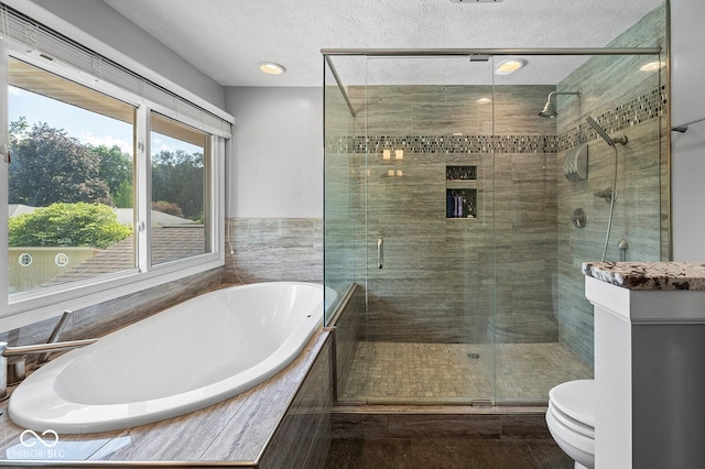 3710 Canada Ct, West Lafayette, IN 47906 - bathroom featuring a garden tub, a shower stall, and a textured ceiling