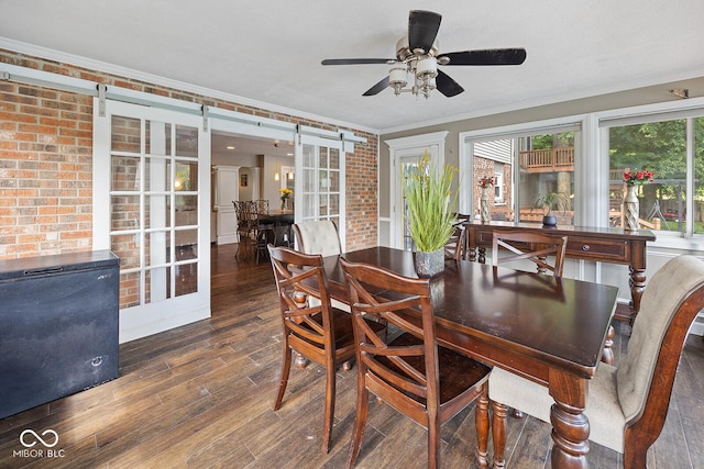 3710 Canada Ct, West Lafayette, IN 47906 - dining space with ornamental molding, wood finished floors, a ceiling fan, and brick wall
