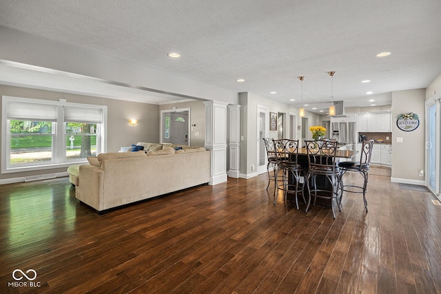 3710 Canada Ct, West Lafayette, IN 47906 - dining space with dark wood finished floors, recessed lighting, and a textured ceiling