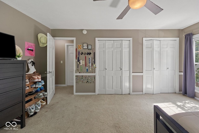 3710 Canada Ct, West Lafayette, IN 47906 - bedroom featuring two closets, carpet flooring, and a ceiling fan