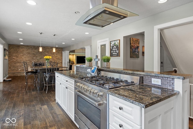 3710 Canada Ct, West Lafayette, IN 47906 - kitchen featuring stainless steel range, ventilation hood, white cabinets, dark wood-style floors, and recessed lighting