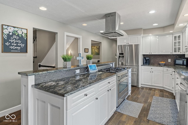 3710 Canada Ct, West Lafayette, IN 47906 - kitchen with appliances with stainless steel finishes, island exhaust hood, a center island, dark wood-style flooring, and white cabinets