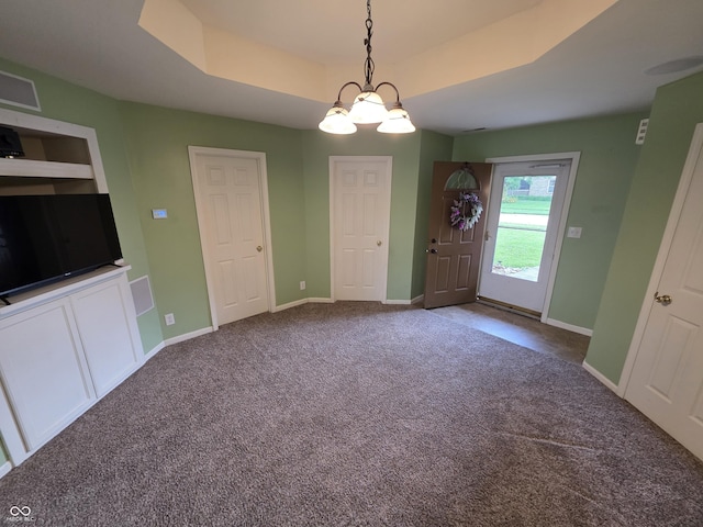 21 Watson Dr, Trafalgar, IN 46181 - unfurnished dining area with carpet floors, a tray ceiling, and a chandelier